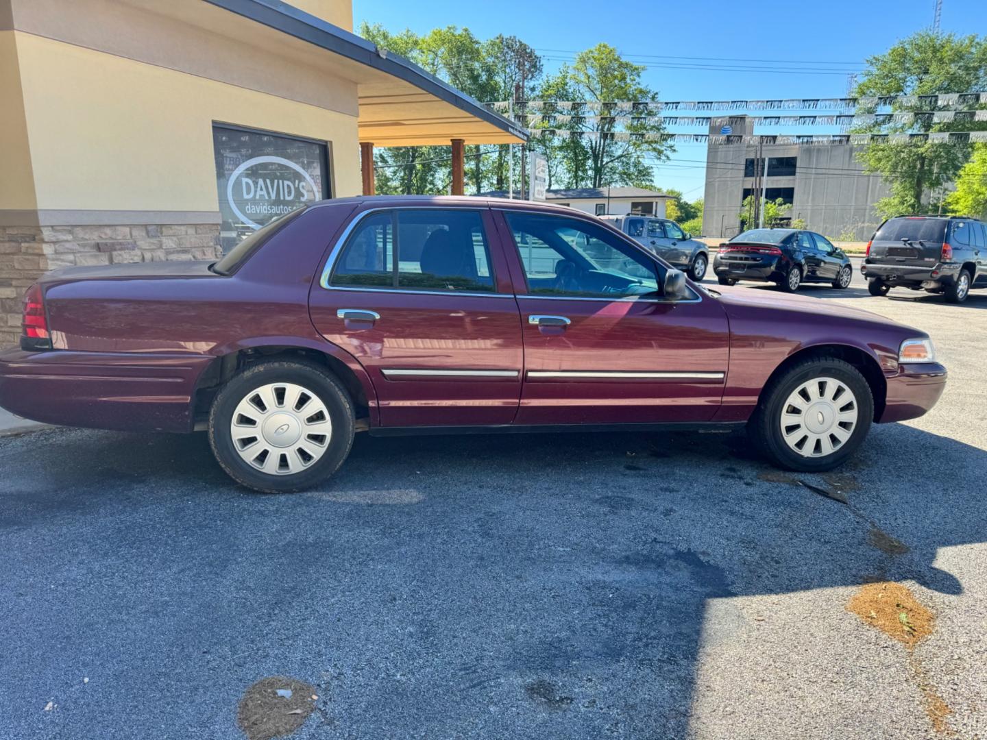 2011 Maroon Ford Crown Victoria (2FABP7BV8BX) , located at 307 West Marshall Avenue, Longview, TX, 75601, (903) 753-3091, 32.500828, -94.742577 - Photo#0